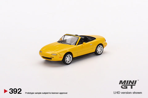 Mini GT 1:64 MiJo Exclusives Mazda Miata MX-5 (NA) Sunburst Yellow - Unrivaled USA