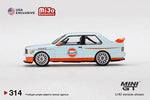 Mini GT 1:64 MiJo Exclusives World Wide BMW M3 E30 with Gulf Livery Limited Edition - Unrivaled USA