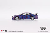 Mini GT 1:64 Nissan Skyline GT-R (R34) V-Spec II in Mini GT Digital Camouflage Purple Mini GT 5 Years Anniversary Model - Unrivaled USA
